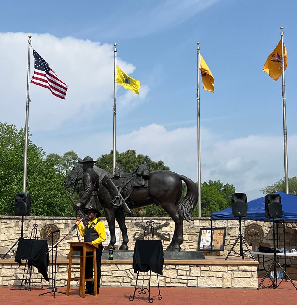 Jim Sands in front of the Buffalo Soldier Memorial, Junction City